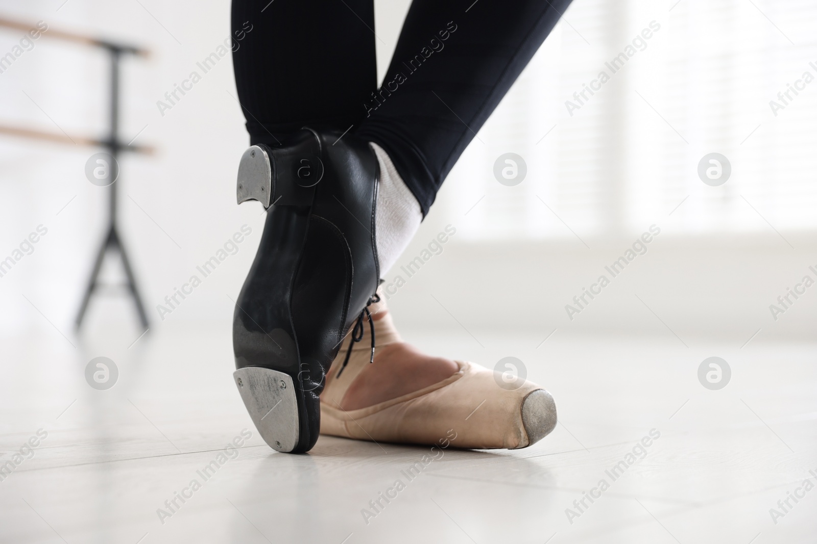 Teenage girl in tap and pointe shoe indoors, closeup Photo of Teenage girl in tap and pointe shoe indoors, closeup