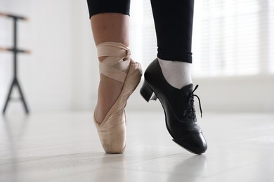 Photo of Teenage girl in tap and pointe shoe indoors, closeup
