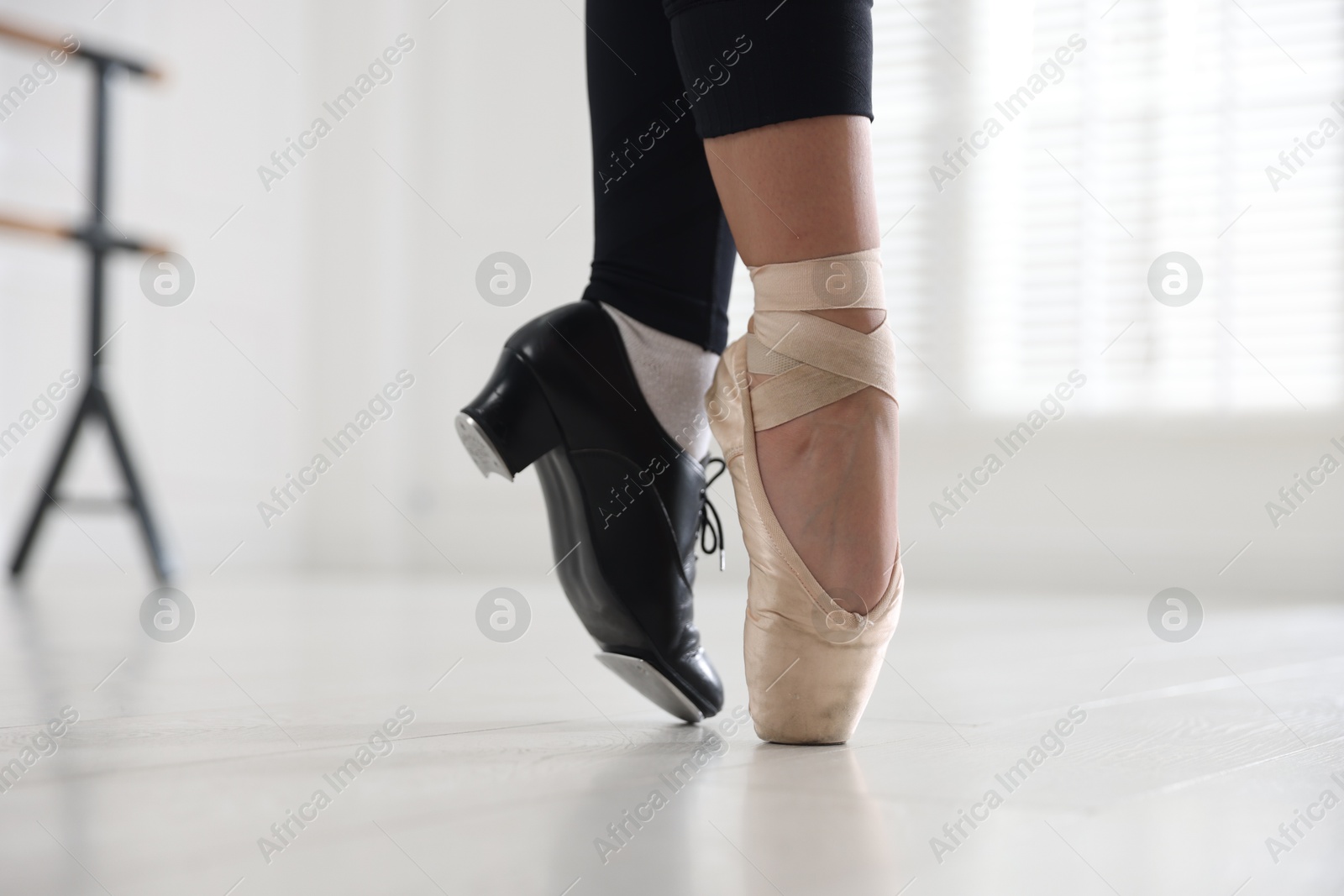 Teenage girl in tap and pointe shoe indoors, closeup Photo of Teenage girl in tap and pointe shoe indoors, closeup