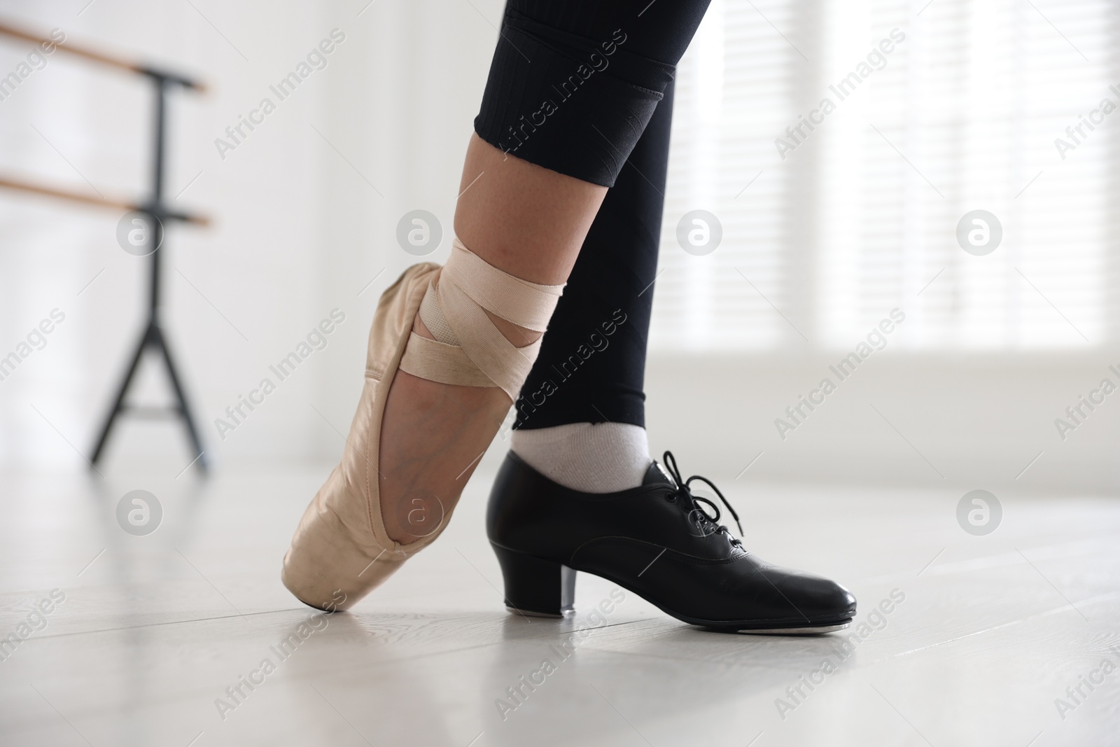 Teenage girl in tap and pointe shoe indoors, closeup Photo of Teenage girl in tap and pointe shoe indoors, closeup