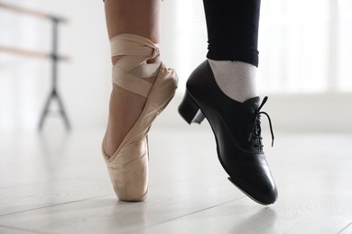 Photo of Teenage girl in tap and pointe shoe indoors, closeup