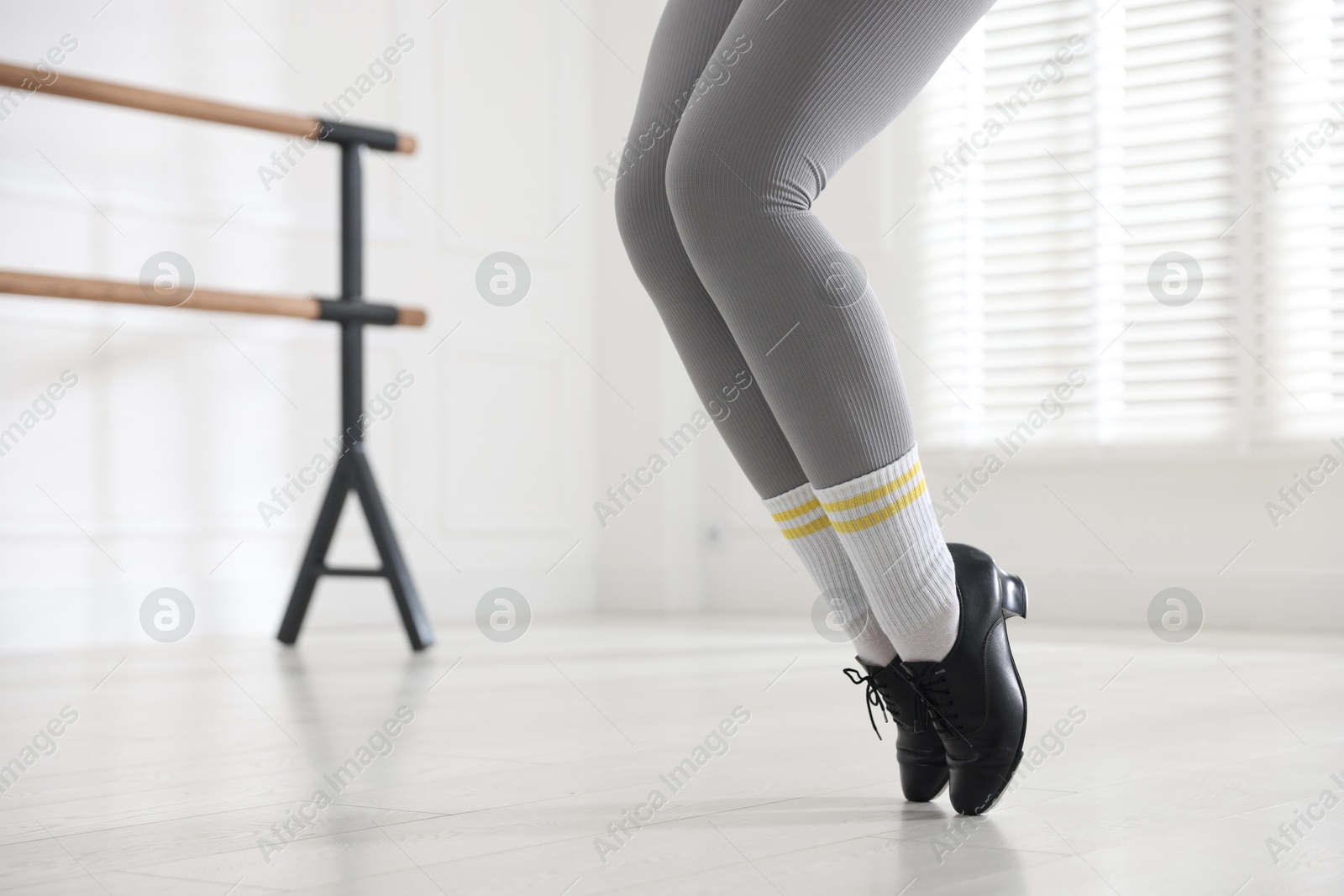 Teenage girl in tap shoes training indoors, closeup Photo of Teenage girl in tap shoes training indoors, closeup