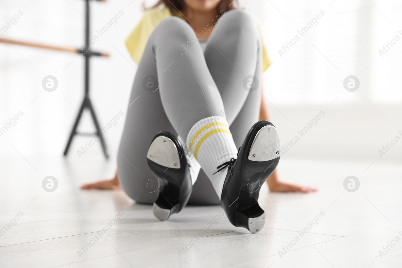 Teenage girl in tap shoes indoors, closeup Photo of Teenage girl in tap shoes indoors, closeup