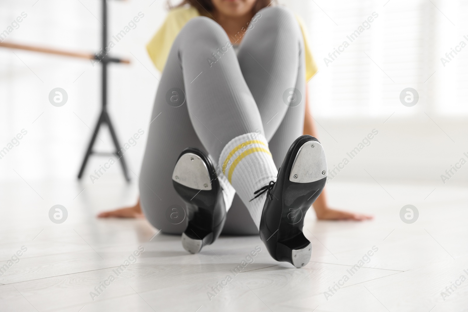 Teenage girl in tap shoes indoors, closeup Photo of Teenage girl in tap shoes indoors, closeup