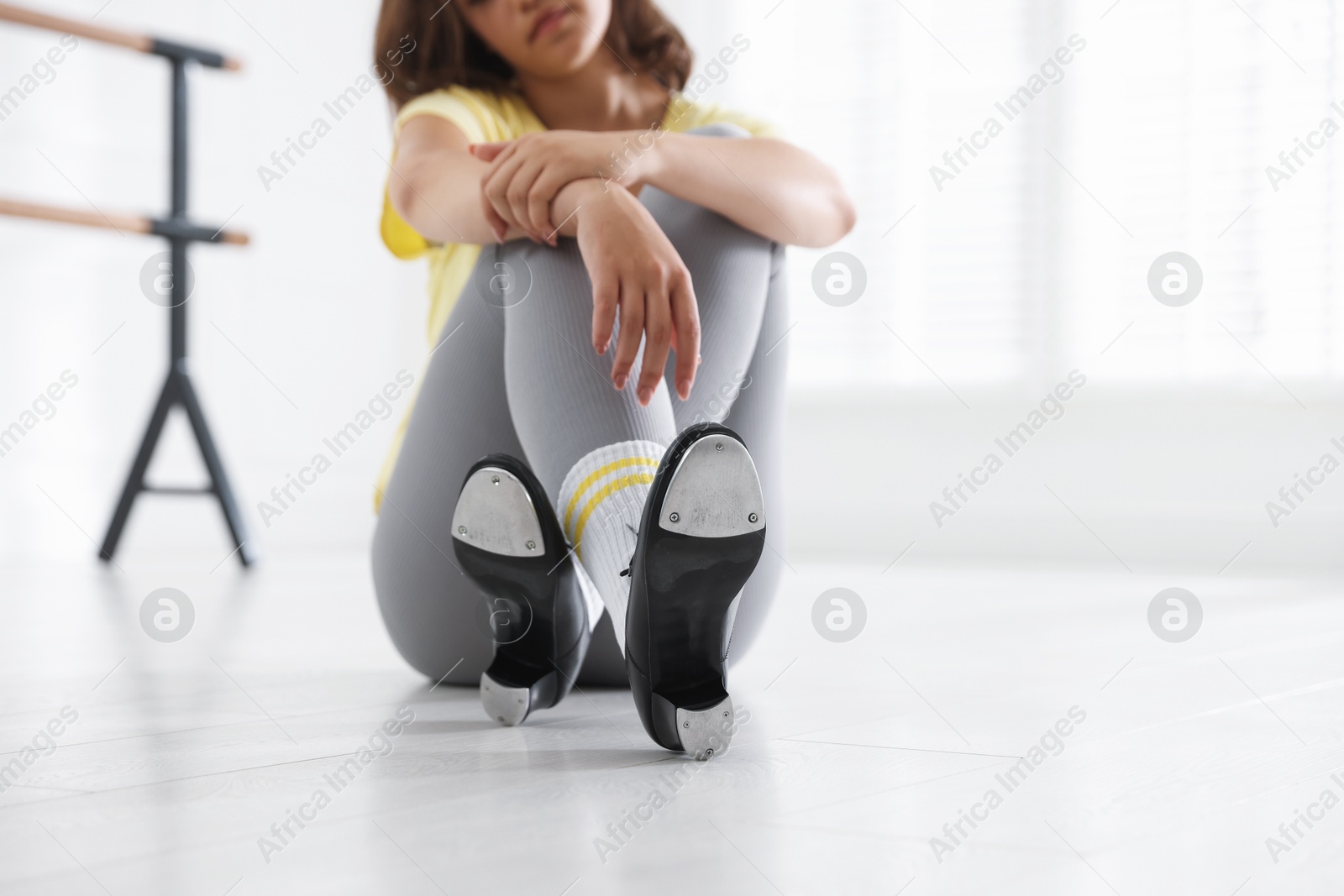 Teenage girl in tap shoes indoors, closeup Photo of Teenage girl in tap shoes indoors, closeup