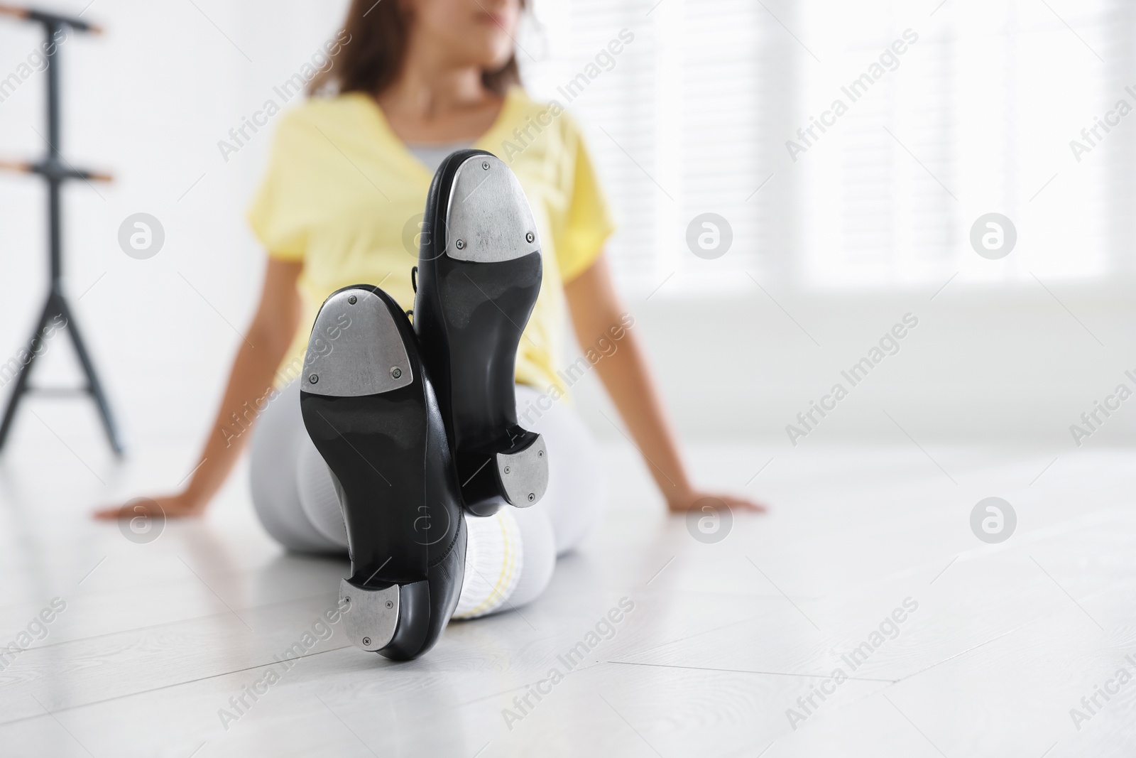 Teenage girl in tap shoes indoors, closeup Photo of Teenage girl in tap shoes indoors, closeup