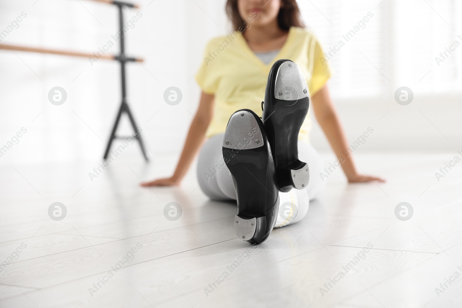 Teenage girl in tap shoes indoors, closeup Photo of Teenage girl in tap shoes indoors, closeup