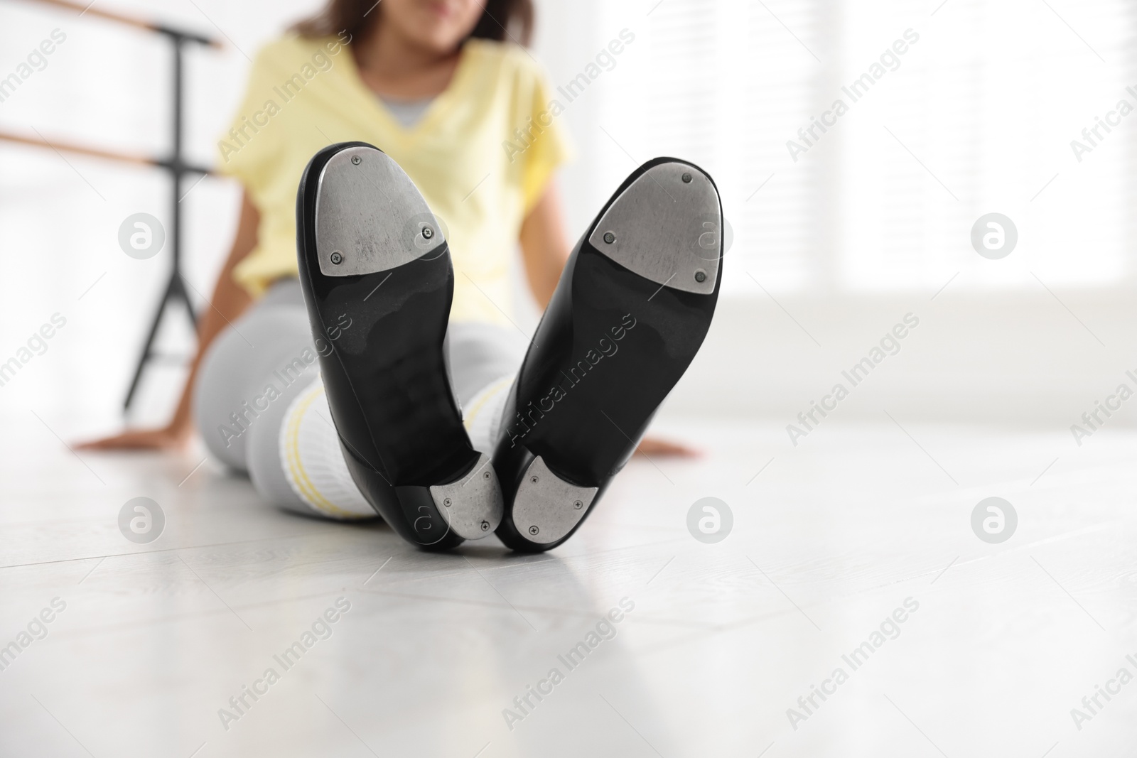 Teenage girl in tap shoes indoors, closeup Photo of Teenage girl in tap shoes indoors, closeup