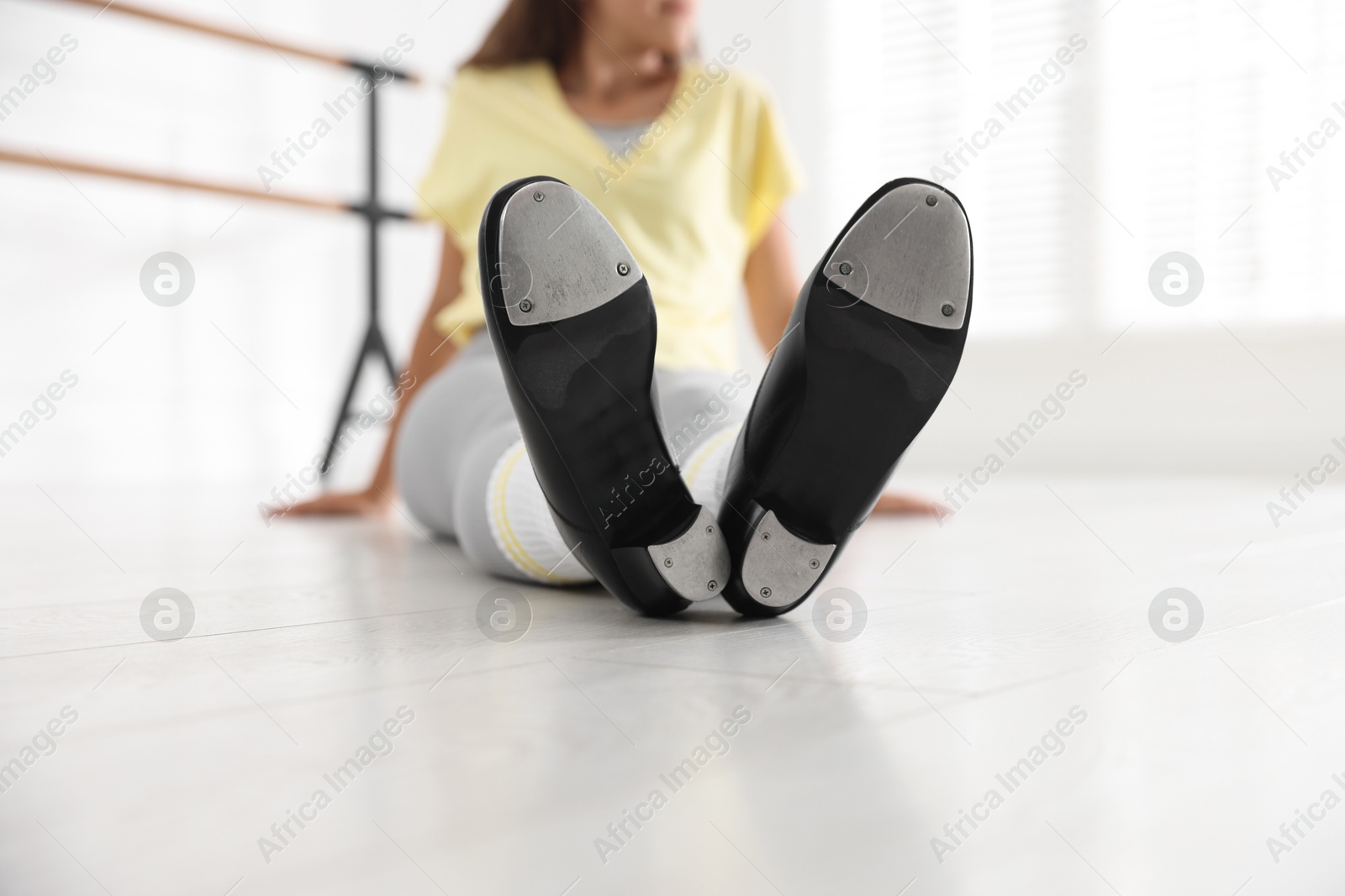 Teenage girl in tap shoes indoors, closeup Photo of Teenage girl in tap shoes indoors, closeup
