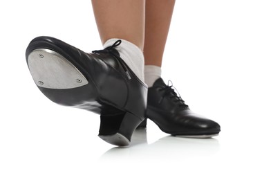 Photo of Teenage girl in tap shoes on white background, closeup