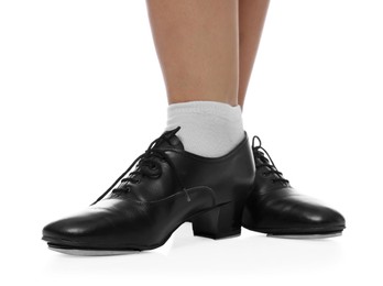 Photo of Teenage girl in tap shoes on white background, closeup
