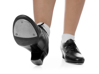 Photo of Teenage girl in tap shoes on white background, closeup