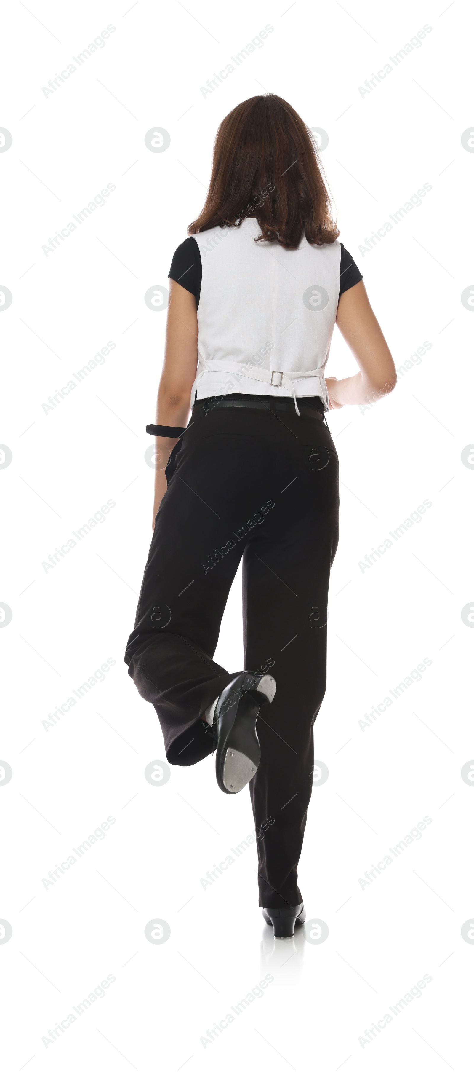 Teenage girl in tap shoes dancing on white background, back view Photo of Teenage girl in tap shoes dancing on white background, back view