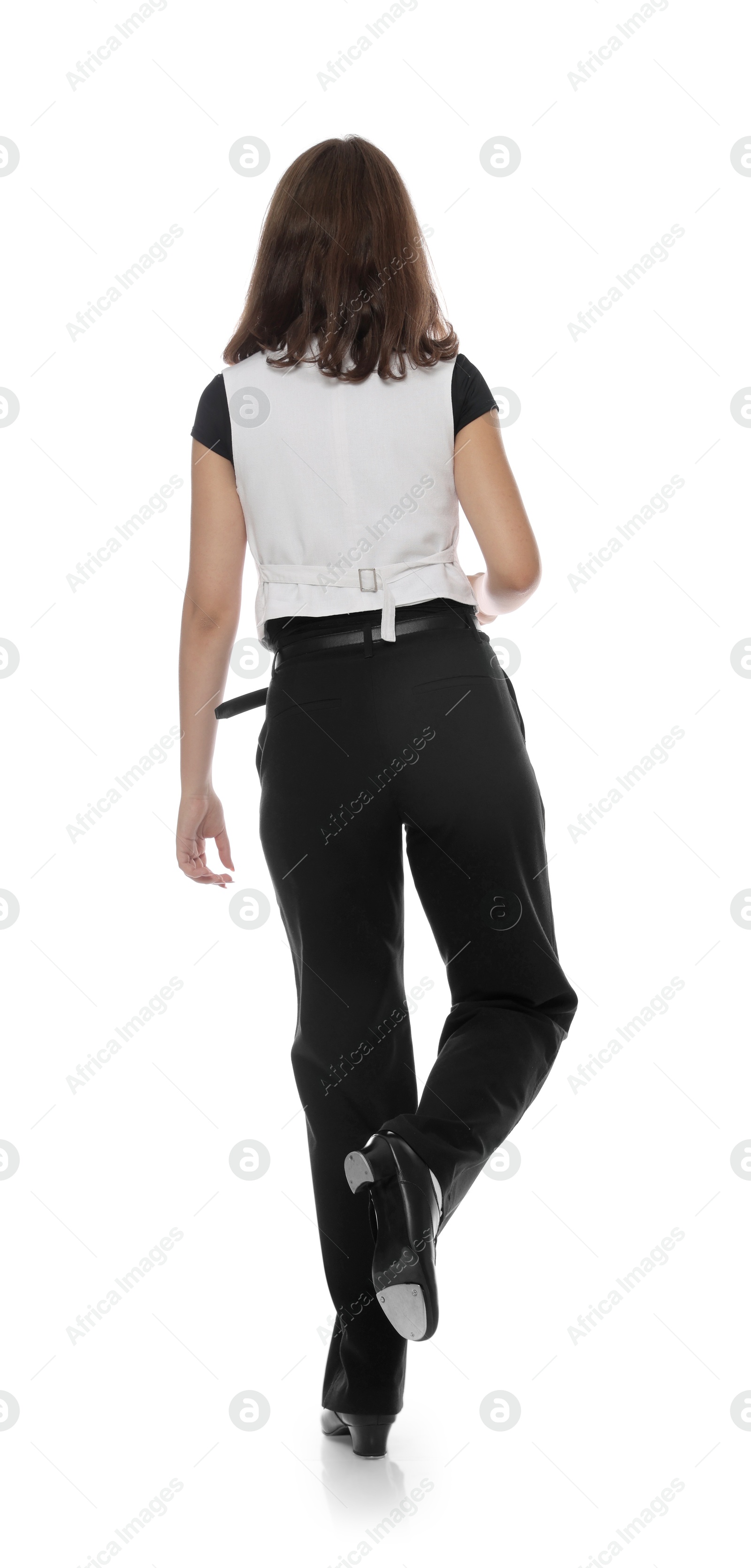 Teenage girl in tap shoes dancing on white background, back view Photo of Teenage girl in tap shoes dancing on white background, back view