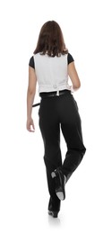 Photo of Teenage girl in tap shoes dancing on white background, back view