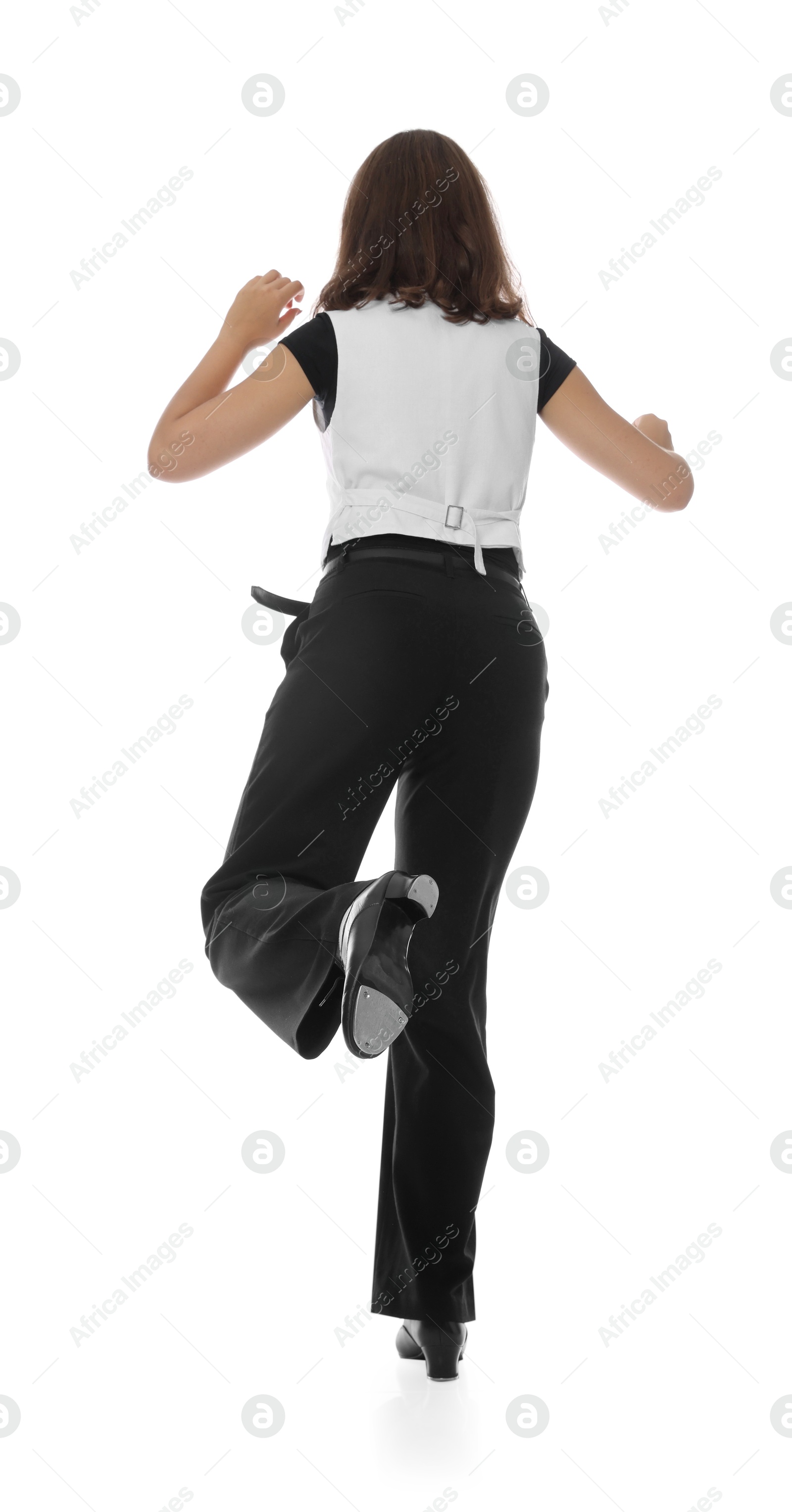 Teenage girl in tap shoes dancing on white background, back view Photo of Teenage girl in tap shoes dancing on white background, back view