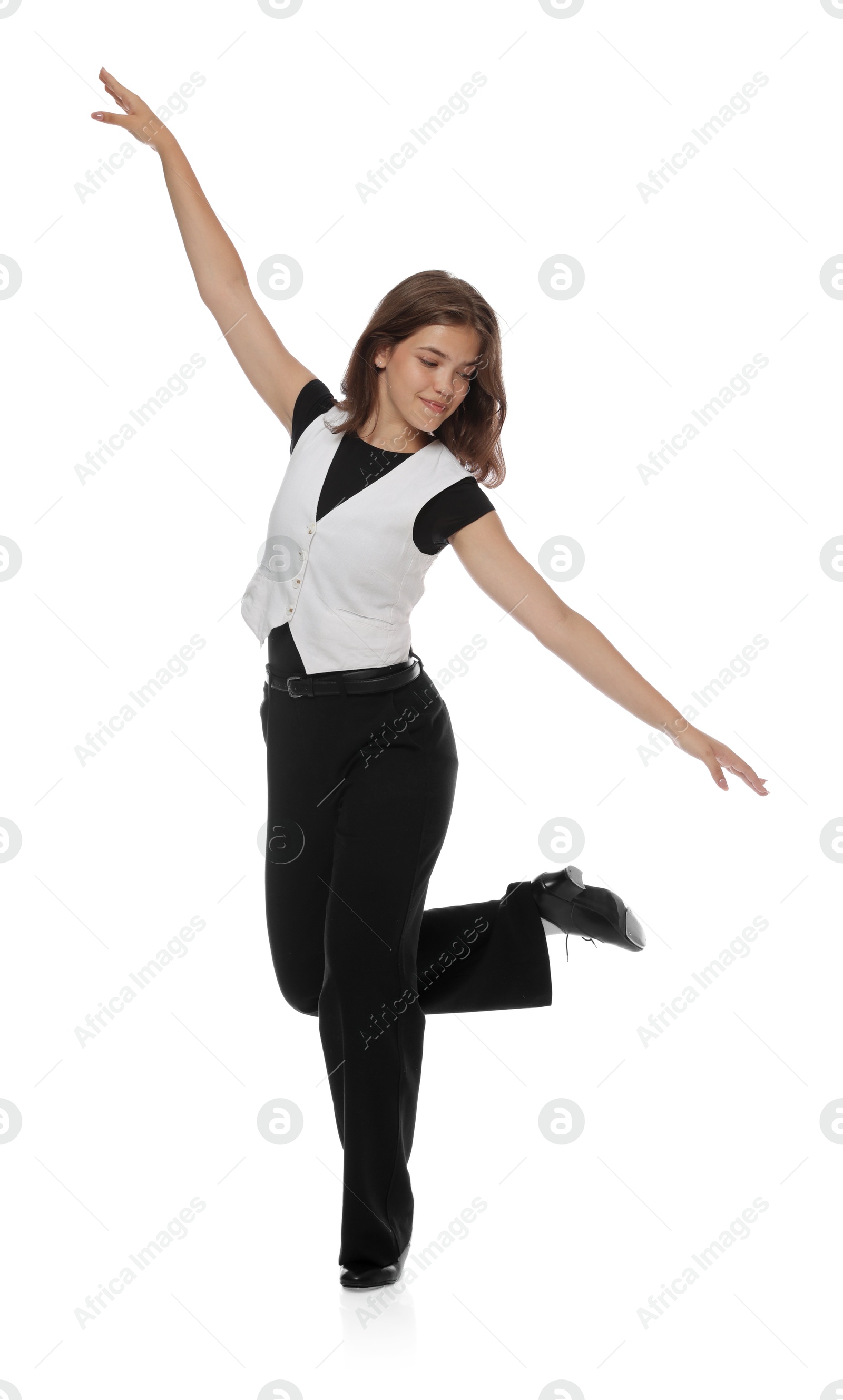 Teenage girl in tap shoes dancing on white background Photo of Teenage girl in tap shoes dancing on white background