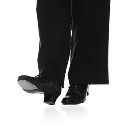 Photo of Teenage girl in tap shoes on white background, closeup