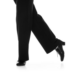 Photo of Teenage girl in tap shoes on white background, closeup