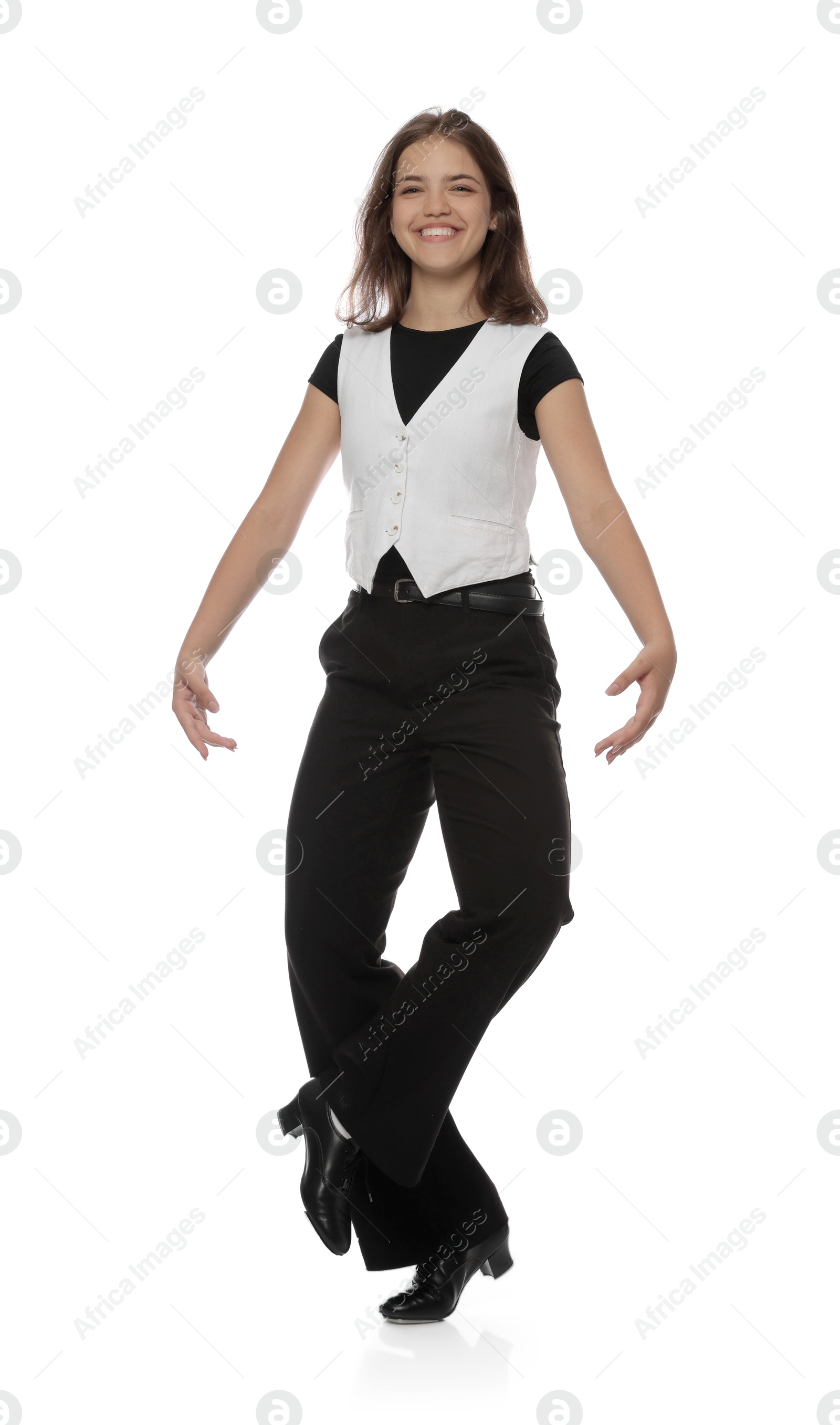 Teenage girl in tap shoes dancing on white background Photo of Teenage girl in tap shoes dancing on white background