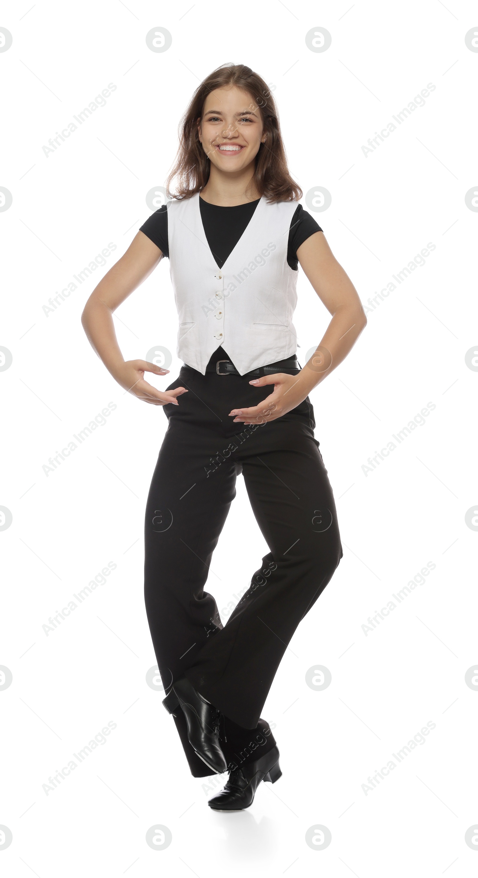 Teenage girl in tap shoes dancing on white background Photo of Teenage girl in tap shoes dancing on white background