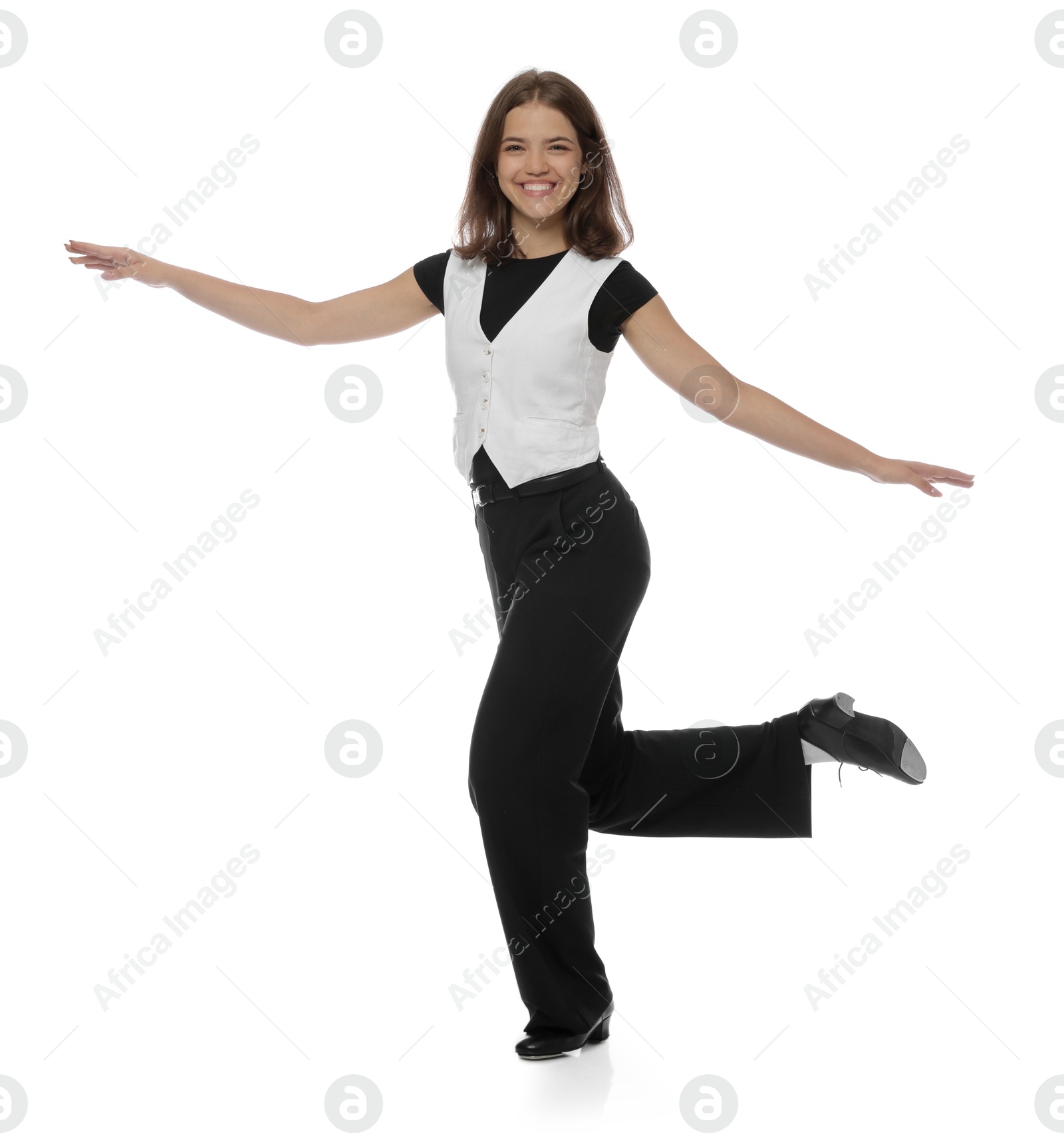 Teenage girl in tap shoes dancing on white background Photo of Teenage girl in tap shoes dancing on white background