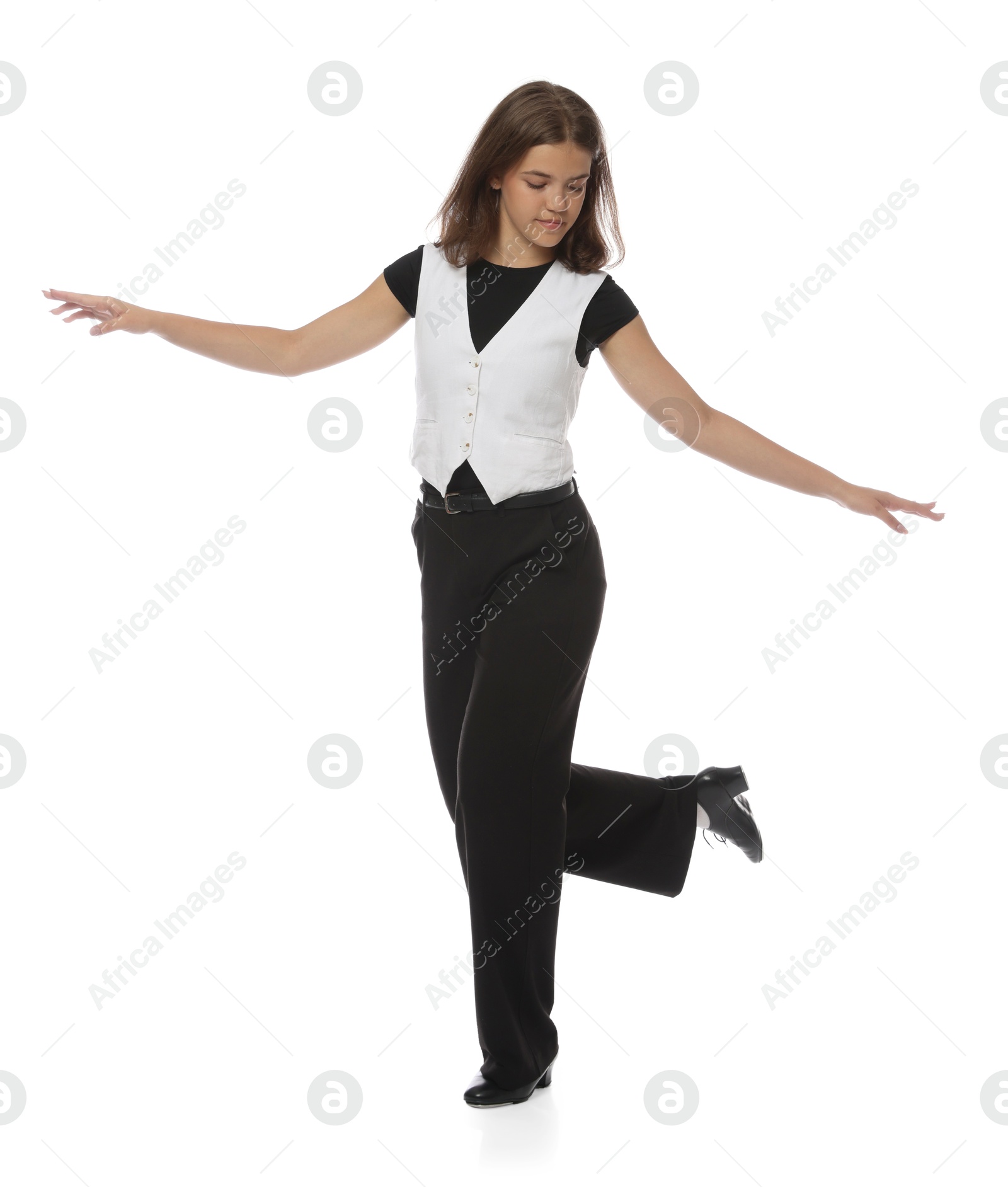 Teenage girl in tap shoes dancing on white background Photo of Teenage girl in tap shoes dancing on white background
