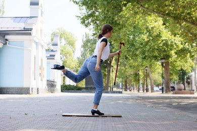 Photo of Teenage girl in tap shoes dancing outdoors