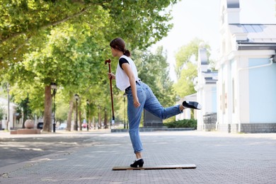 Photo of Teenage girl in tap shoes dancing outdoors