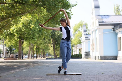 Photo of Teenage girl in tap shoes dancing outdoors