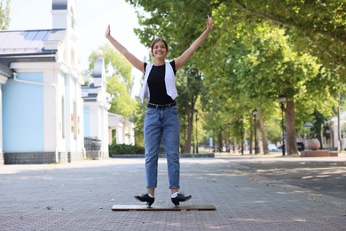Photo of Teenage girl in tap shoes dancing outdoors