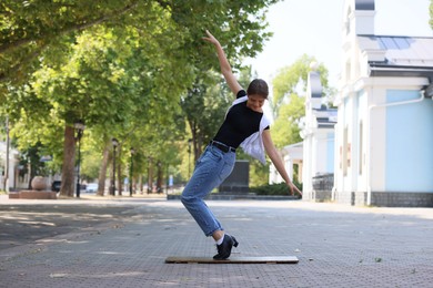 Photo of Teenage girl in tap shoes dancing outdoors