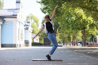 Photo of Teenage girl in tap shoes dancing outdoors