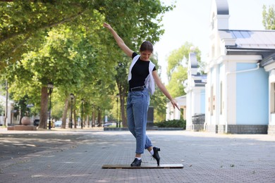 Photo of Teenage girl in tap shoes dancing outdoors