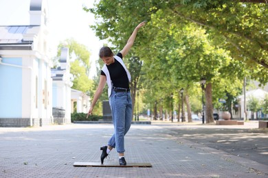 Photo of Teenage girl in tap shoes dancing outdoors