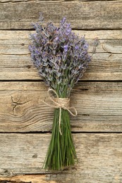Photo of Bunch of beautiful lavender flowers on wooden table, top view