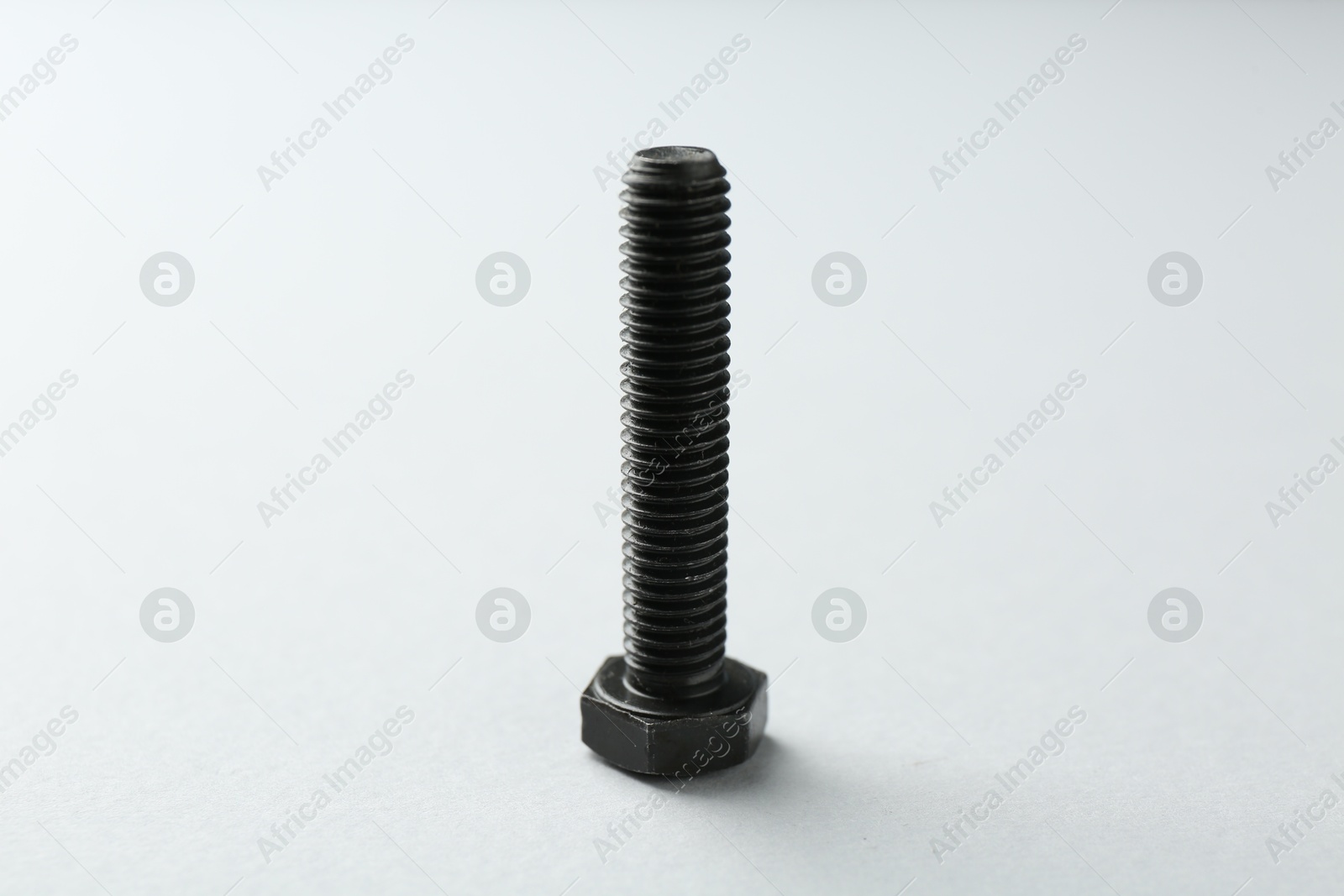 One metal bolt on white background. Hardware tool Photo of One metal bolt on white background. Hardware tool
