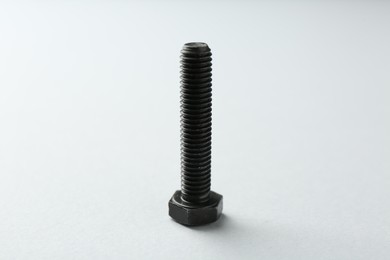 Photo of One metal bolt on white background. Hardware tool