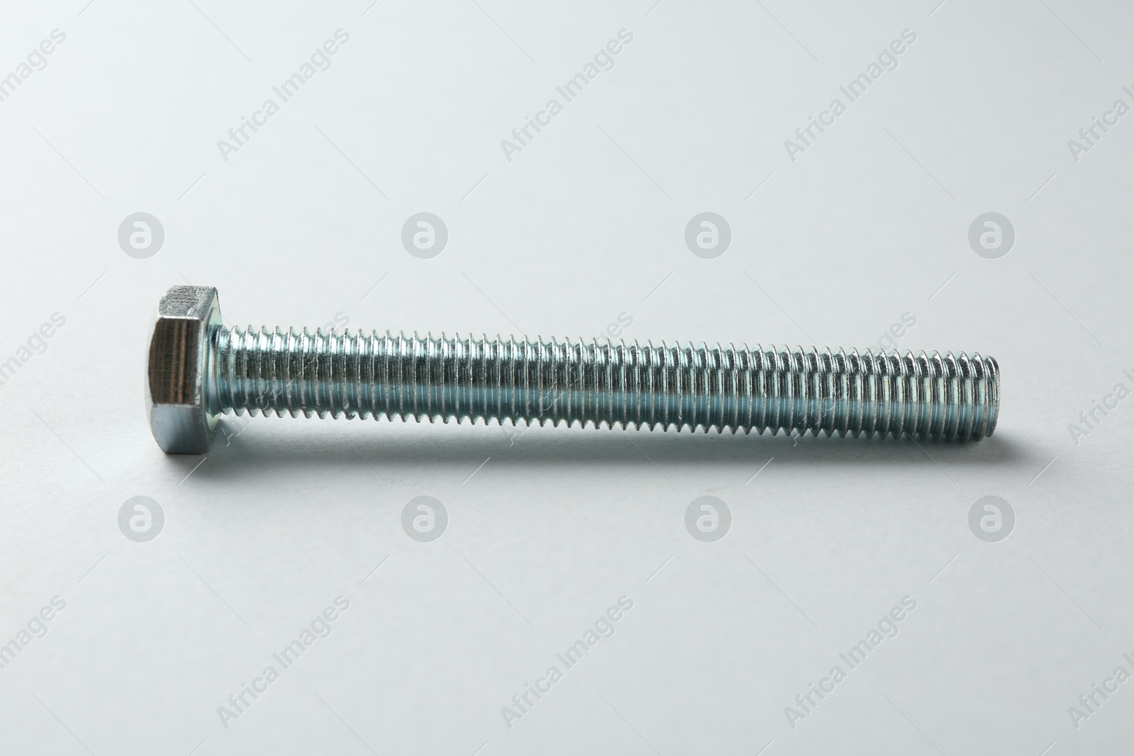 One metal bolt on white background. Hardware tool Photo of One metal bolt on white background. Hardware tool