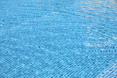 Photo of Swimming pool with clean blue water as background. Summer vacation