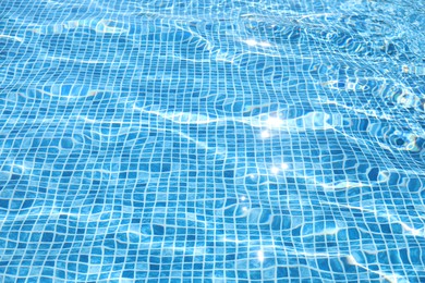 Photo of Swimming pool with clean blue water as background. Summer vacation