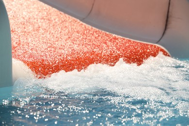 Photo of Wide slide at water park, closeup. Summer vacation