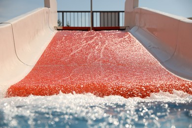 Photo of Wide slide at water park. Summer vacation