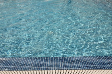 Photo of Swimming pool with clean blue water. Summer vacation