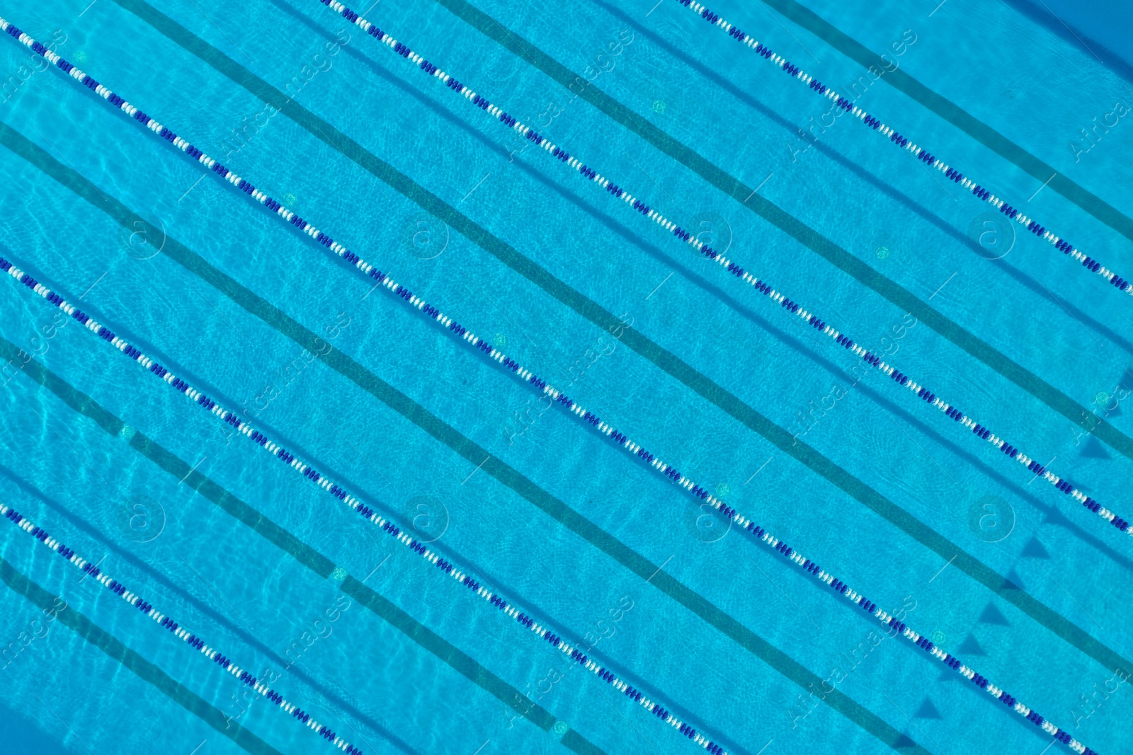 Aerial view of outdoor swimming pool on sunny day Photo of Aerial view of outdoor swimming pool on sunny day