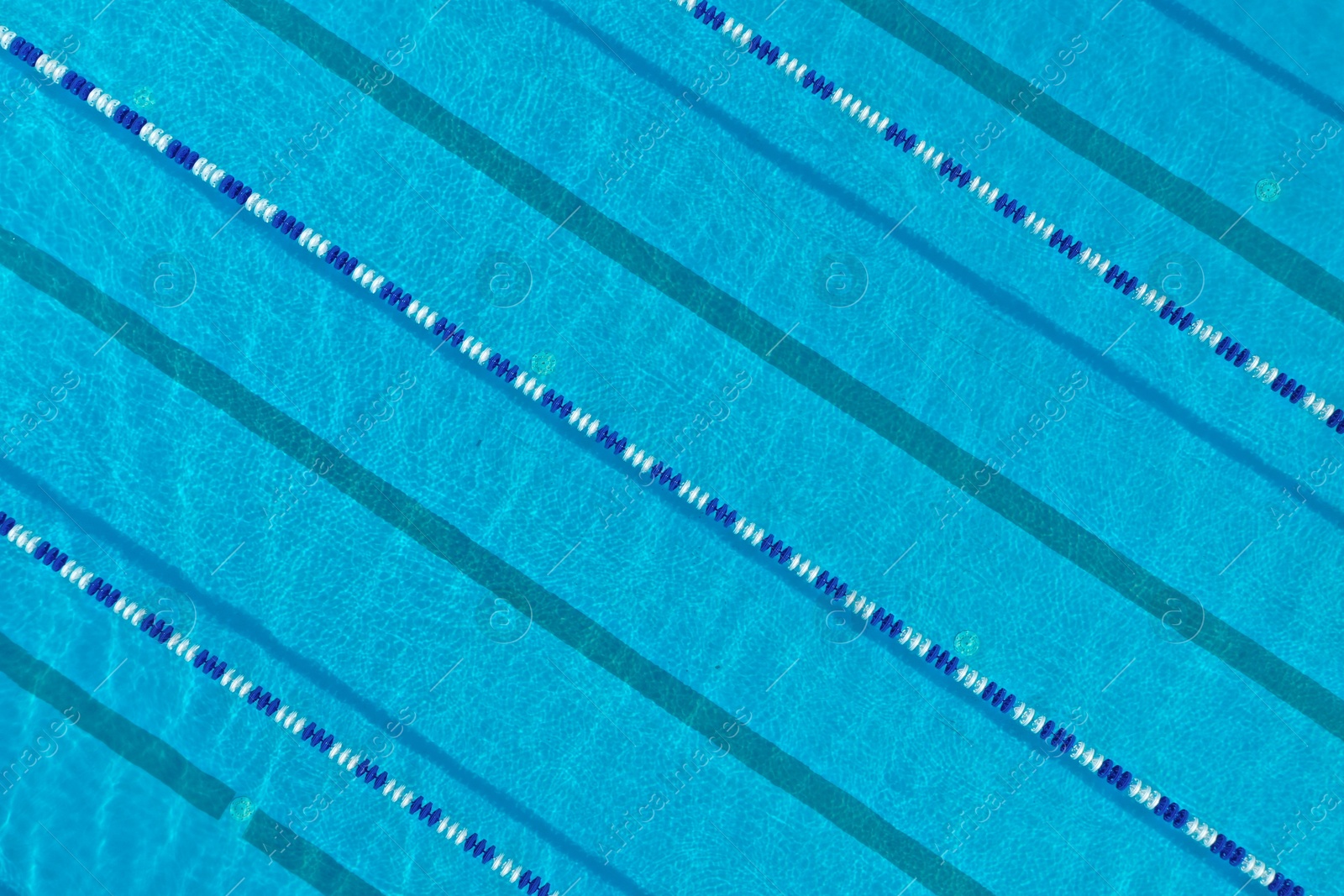 Aerial view of outdoor swimming pool on sunny day Photo of Aerial view of outdoor swimming pool on sunny day