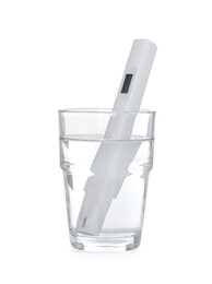 Photo of Nitrate tester in glass of water isolated on white