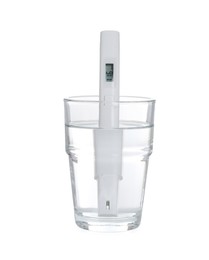 Photo of Nitrate tester in glass of water isolated on white