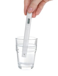 Photo of Woman examining water with nitrate tester on white background, closeup