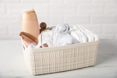 Photo of Many different baby accessories on table near brick wall